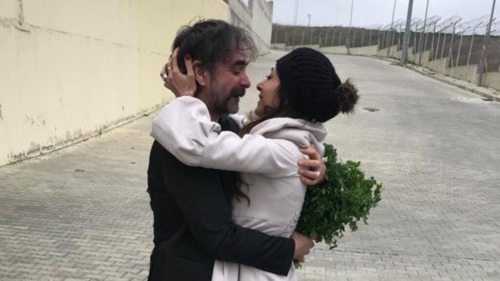 Detained without charge: Deniz Yücel hugs his wife, Dilek Mayatürk Yücel, after being released in Istanbul. Photograph: Veysel Ok/Twitter via Reuters
