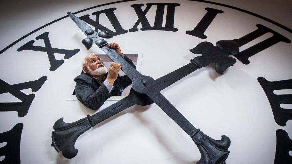 Hungarian watchmaker Istvan Hanga adjusts the hands of a clock, operated by Kecskemet Cathedral’s original mechanism, in the Bozso House Watch Collection in Hungary. Photograph: Sandor Ujvari/EPA