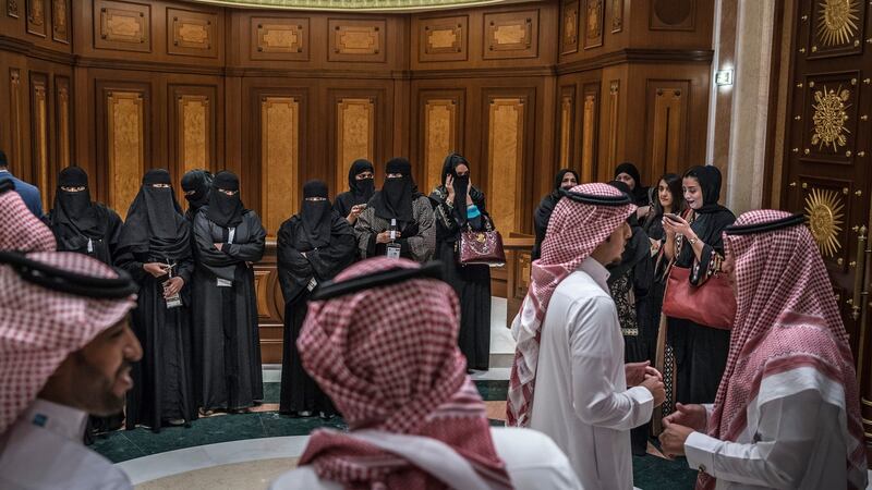 Saudi women stand on the opposite side of the hallway from men at the American Express World Luxury Expo in Riyadh on March 30th. Photograph: Sergey Ponomarev/The New York Times