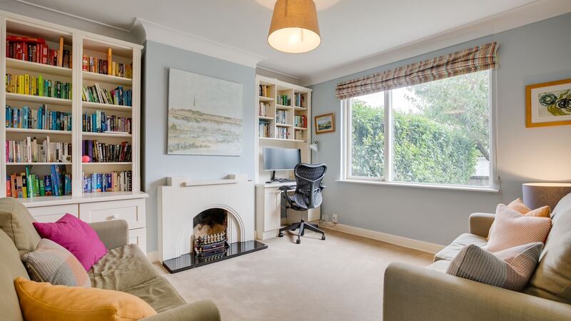 Livingroom at front of the house which is also being used as an office