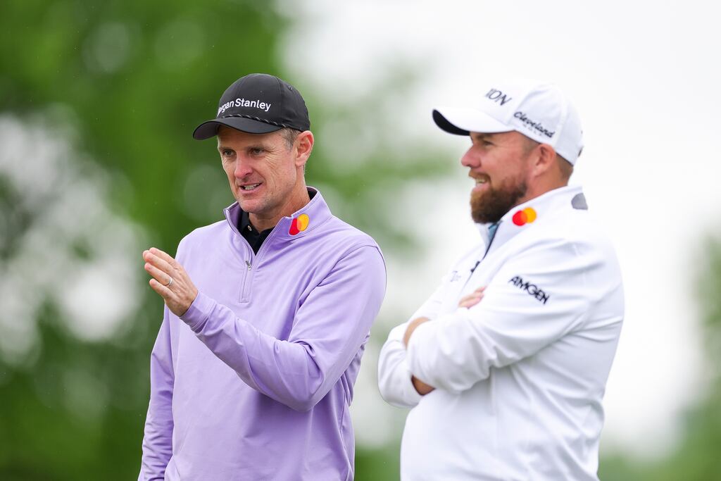 Justin Rose of England talks with Shane Lowry of Ireland while playing the 15th hole during the second round of the Truist Championship at The Wissahickon at Philadelphia Cricket Club. Photograph: Andrew Redington/Getty