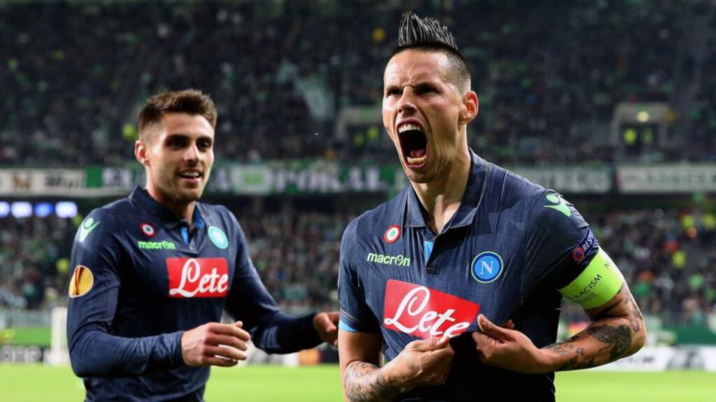 Napoli’s Slovakian midfielder Marek Hamsik (right) celebrates after scoring his team’s second goal in the Europa League first-leg quarter-final match away to VfL Wolfsburg. Photograph: Ronny Hartmann/AFP/Getty Images