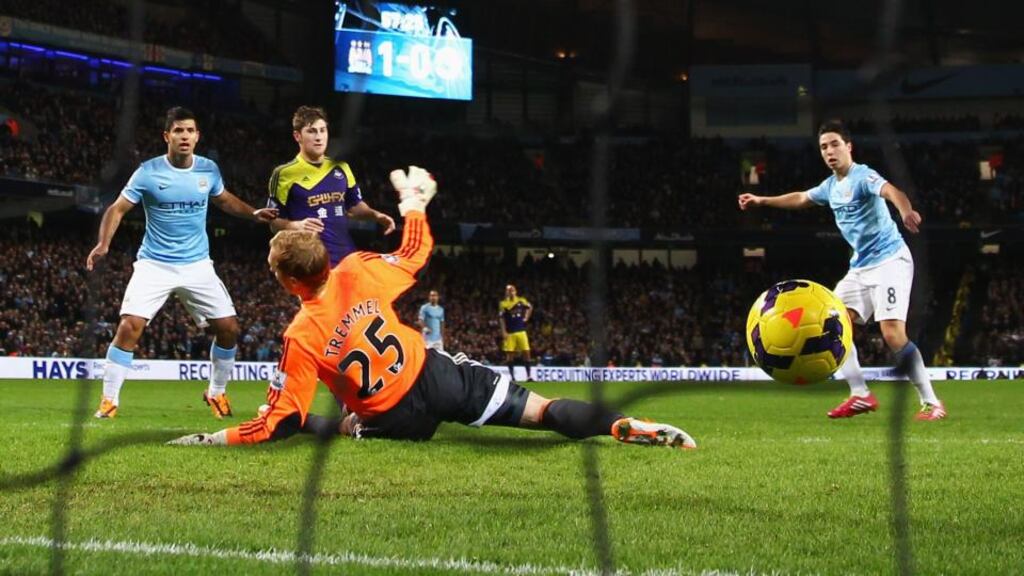 Samir Nasri scores Manchester City’s second goal during the Premier League match against Swansea City at Etihad Stadium. Photograph: Clive Brunskill/Getty Images