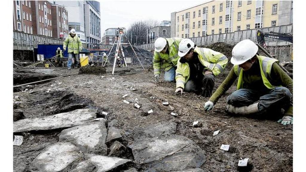 Archaeologists from Margaret Gowen Co comb through the site at Hammond Lane, off Church Street, just north of the Liffey. It is hoped to establish that a "Hiberno-Norse suburb" existed there. Photograph: Dara Mac Dónaill