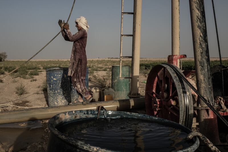 A well-drilling crew searches for water on a farm in Shagai, in southwest Afghanistan’s arid Bakwa district on August 16th, 2023. Solar-powered water pumps fuelled a boom in narcotics crops in the Bakwa, though the use of private reservoirs — an incredibly wasteful method of irrigation due to quick evaporation in the desert heat — has left the water quickly running out. Photograph: Bryan Denton/The New York Times