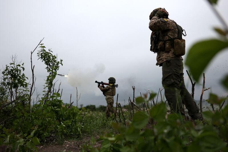 Ukrainian soldiers of the 28th Separate Mechanised Brigade fire a grenade launcher at the front line near Bakhmut, Donetsk region, on June 17th. Photograph: Anatolii Stepanov /AFP/Getty