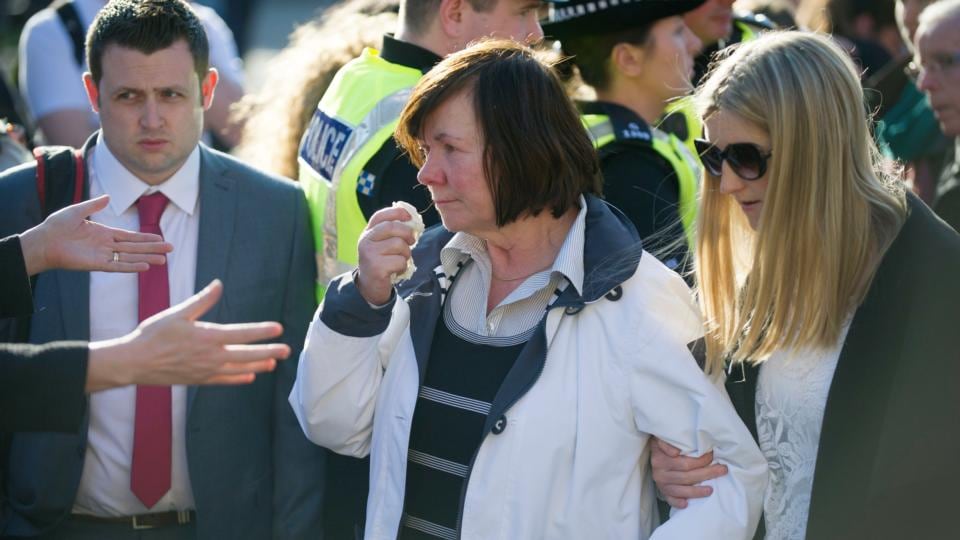 Marian Buckley (centre), the mother of Karen Buckley, is comforted as she joins hundreds of mourners at a vigil for her daughter in George Square, Glasgow. Photograph: Jane Barlow/PA Wire.