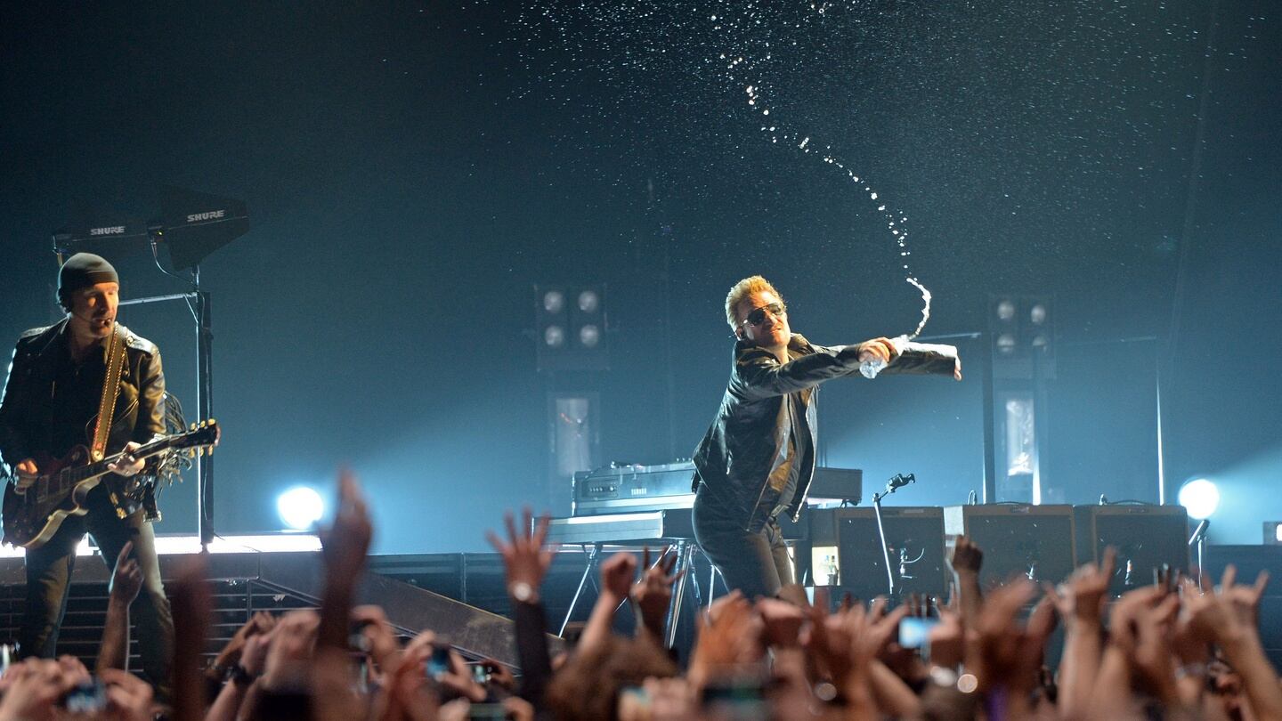 Bono sprays the audience with water, when U2 perform on stage in the ‘iNNOCENCE + eXPERIENCE’ show , at the 3 Arena , Dublin. Photograph: Eric Luke / The Irish Times