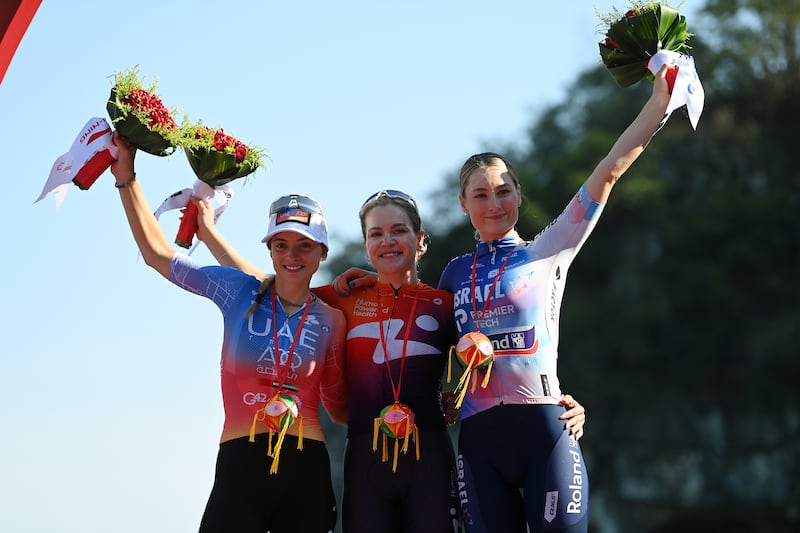 Italy's Chiara Consonni (second), Poland's Daria Pikulik (winner) and Mia Griffin (third) on the podium after a stage of the Tour of Guangxi women's elite world challenge on October 17th, 2023, in Guilin, China. Photograph: Tim de Waele/Getty Images