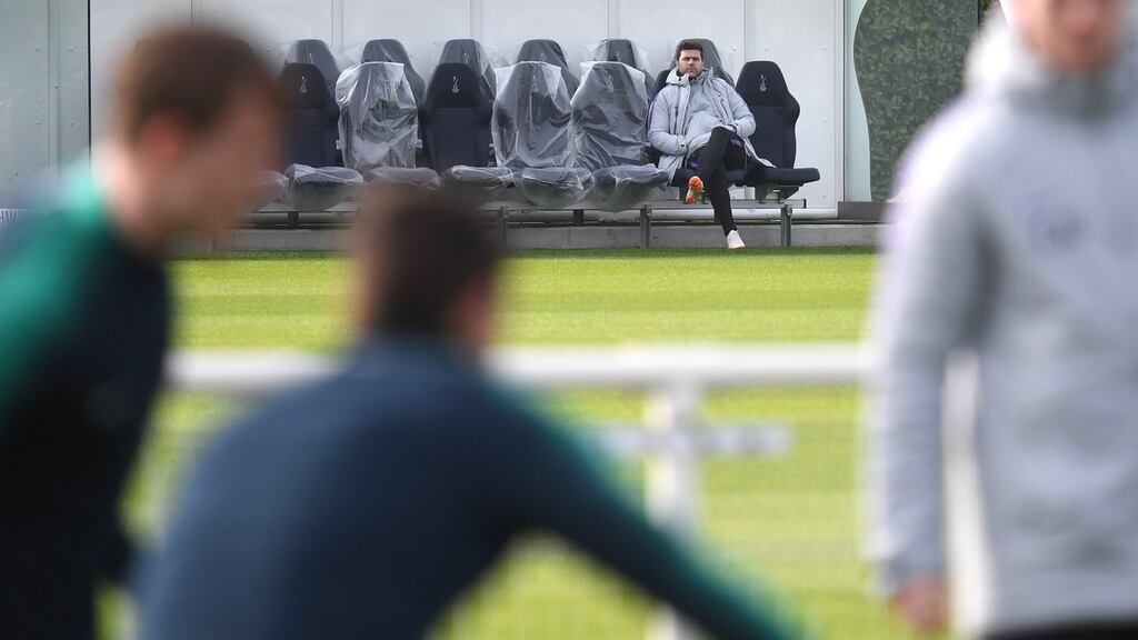 Tottenham Hotspur’s manager Mauricio Pochettino watches his players during the team’s training session at Spurs’ training ground in London. Tottenham will face Borussia Dortmund in their Uefa Champions League round 16 match on Wednesday. Photograph: Neil Hall/EPA