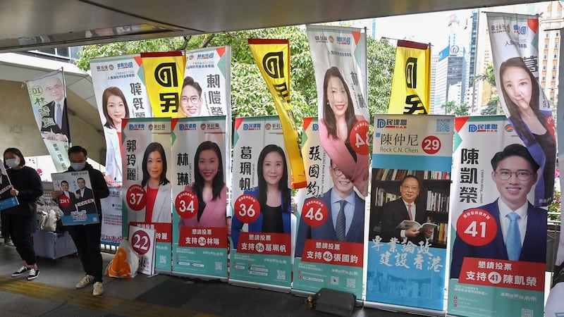 Banners of various candidates are seen as supporters canvas for votes in the Legislative Council elections in Wanchai district of Hong Kong on Sunday. Photograph: AFP via Getty Images