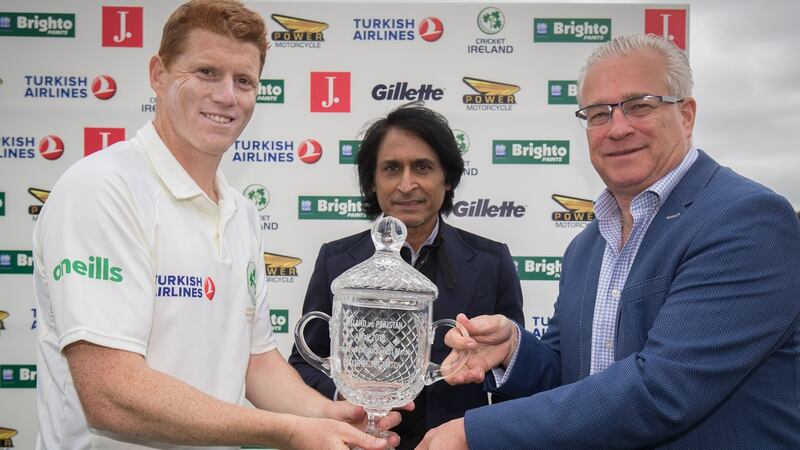 Kevin O’Brien is handed the man of the match award by Ross McCollum and Rameez Raja. Photograph: Oisin Keniry/Inpho