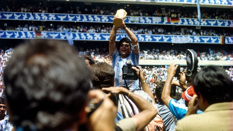 Diego Maradona with the World Cup trophy in 1986. Photo: Schlage/ullstein bild via Getty Images
