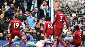 Manchester City ease past Liverpool at the Etihad to keep pressure on Arsenal