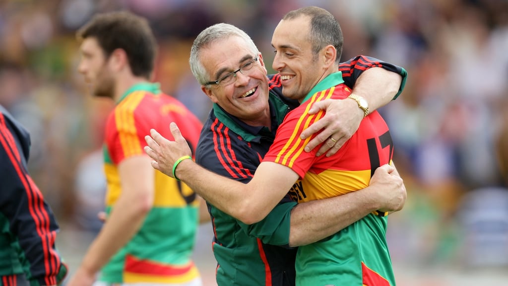 Carlow manager Luke Dempsey celebrates with goalscorer JJ Smith after the county’s draw with Meath in the 2012 Leinster championship. Photograph: Cathal Noonan/Inpho
