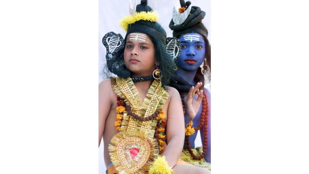 Indian children take part in a ceremony on the birthday of the Hindu god Shiva in the northern Indian city of Chandigarh yesterday. Many Hindu women celebrate 'Shiv Ratri', which falls on February 18th this year, to pray that their husbands have long lives.