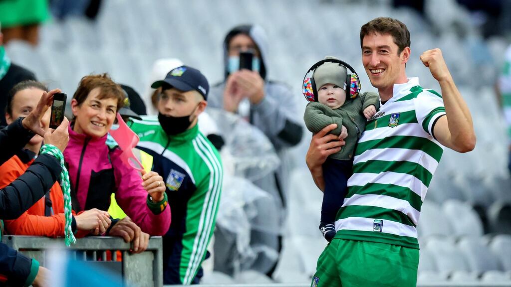 Limerick goalkeeper Nickie Quaid celebrates with his son Daithi after the semi-final win over Kilkenny. Photo: Ryan Byrne/Inpho