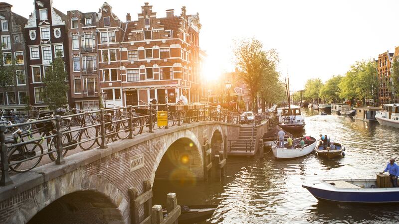 Bicycles and canals in the Jordaan district of Amsterdam, Netherlands. Coffee shops in the city are allowed to sell cannabis to tourists on the grounds that the practice is part of the attraction for tourists visiting the city. File photograph: Tim E White/Getty Images