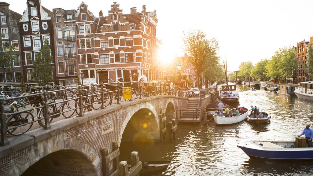 Bicycles and canals in the Jordaan district of Amsterdam, Netherlands. Coffee shops in the city are allowed to sell cannabis to tourists on the grounds that the practice is part of the attraction for tourists visiting the city. File photograph: Tim E White/Getty Images