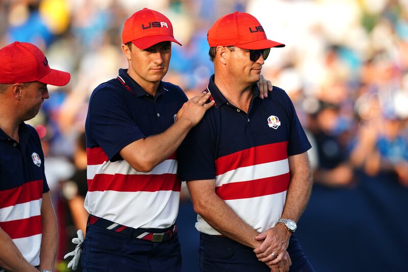 Jordan Spieth with a dejected USA captain Zach Johnson after Europe regained the Ryder Cup at the Marco Simone Golf and Country Club, Rome, Italy. Photograph: Mike Egerton/PA Wire