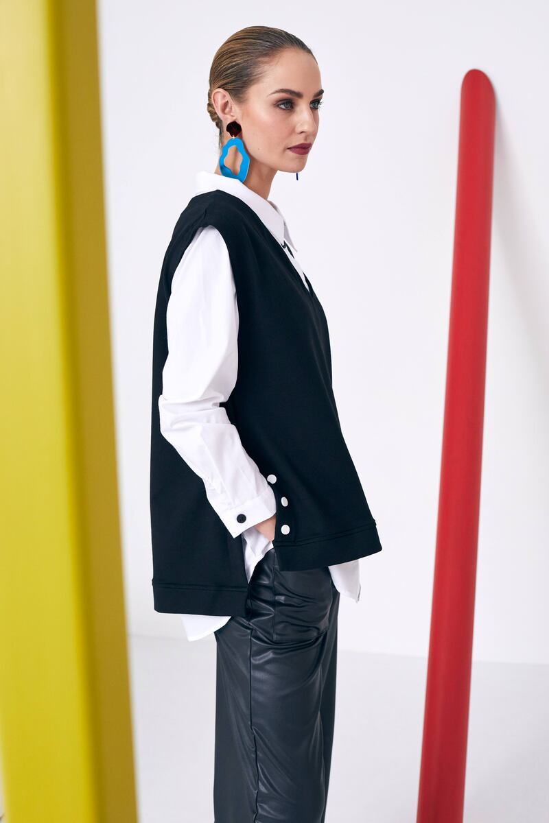 Jersey side buttoned vest €171, leatherette turn up trousers €109