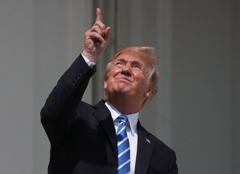 Donald Trump looks up at the solar eclipse of August 21st, 2017 from a balcony in the White House. Photograph: Mark Wilson/Getty Images