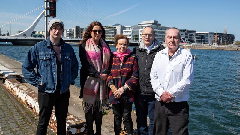 Daniel Cullen’s family, from left, his brother Ryan Cullen, his cousin Aoife McKeone,  his mother Mary Cullen,  and his uncles Colum Donaghy  and Marty Cullen  on Sir John Rogerson’s Quay where Daniel lost his life after falling into the Liffey. Photograph:  Colin Keegan, Collins Dublin