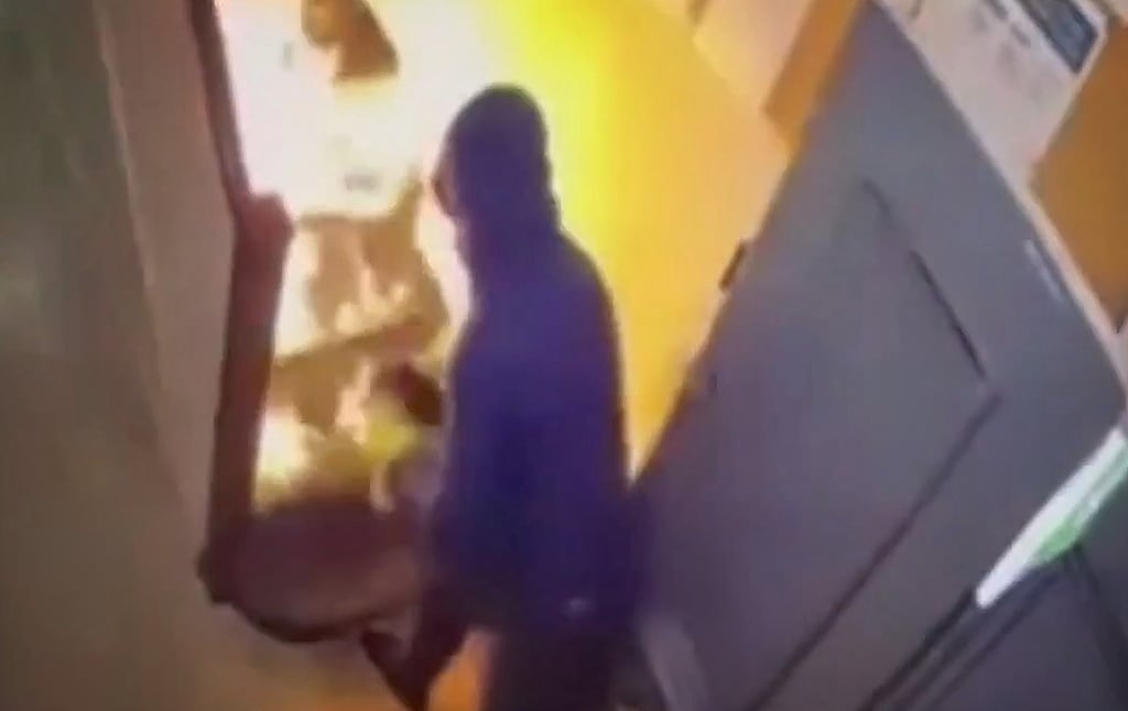 A still image from CCTV shows a man starting a fire at an Ipas centre in Drogheda, Co Louth, last weekend.