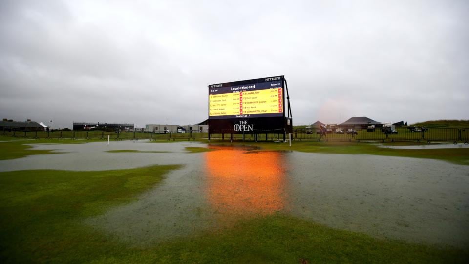 A view of the scoreboard on the flooded 18th hole fairway as rains falls prior to the second round of the 144th Open Championship at The Old Course. Photograph: Matthew Lewis/Getty Images