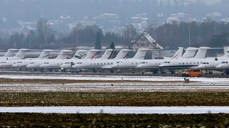 Passenger jets are parked at the Swiss Airforce base in Duebendorf, Switzerland, akin to a carpark for elite WEF participants Photograph: Reuters