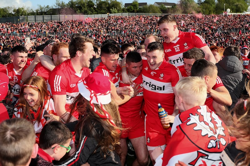 Derry players celebrate with supporters after the victory over Armagh. Photograph: Laszlo Geczo/Inpho