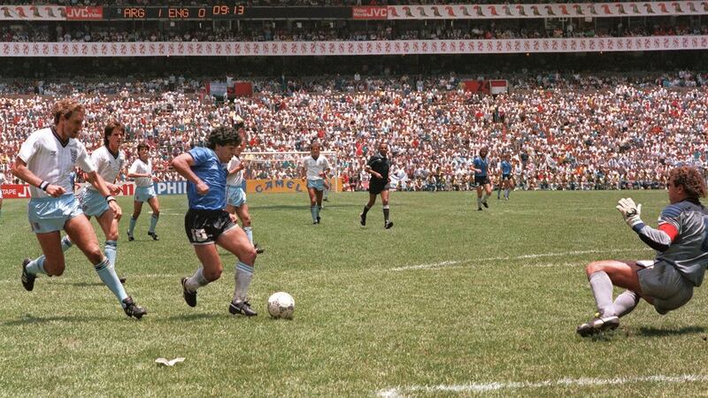 Diego Maradona rounds Peter Shilton to score one of the most famous goals ever during the 1986 World Cup quarter-final. Photo: Getty Images