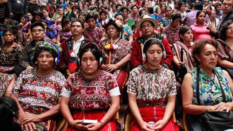 Indigenous Mayan women listen to translators at the hearing of Rios Montt, former leader of Guatemala, the first former head of state to be charged with genocide in a domestic court. Photograph: Elena Hermosa/Trócaire