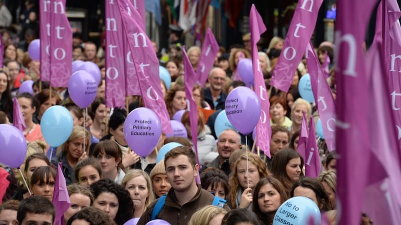 Teachers, parents and children attend the INTO protest outside the Department of Education on Marlborough Street, Dublin, yesterday. Photograph: Dara Mac Dónaill