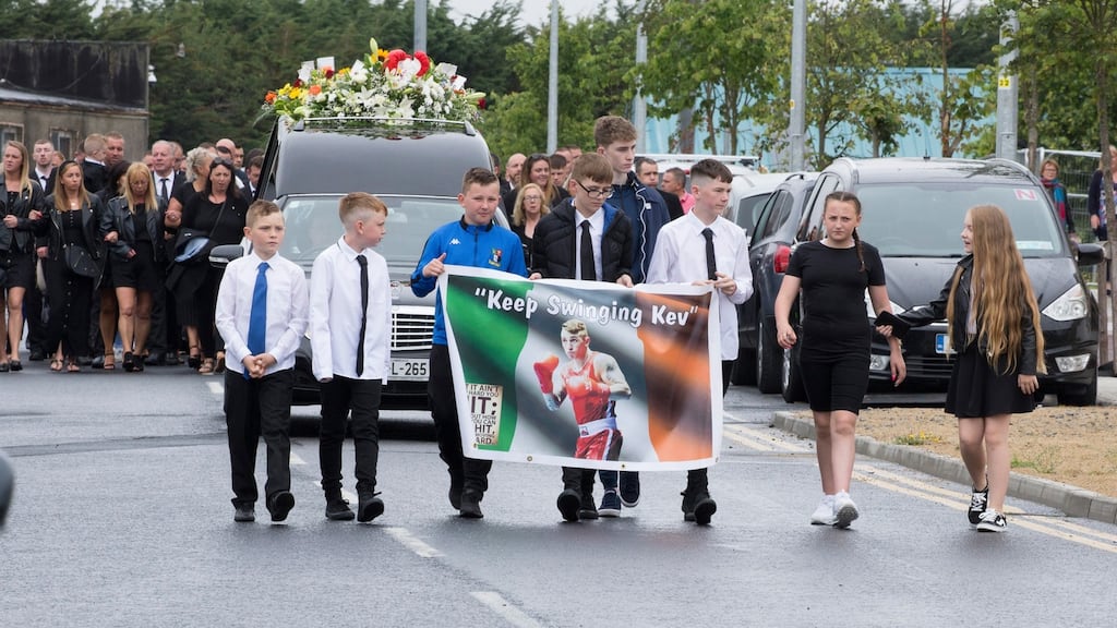 Boxer Kevin Sheehy’s funeral cortege arrives at the Holy Family Church, Southill, Limerick. Photograph Liam Burke/Press 22