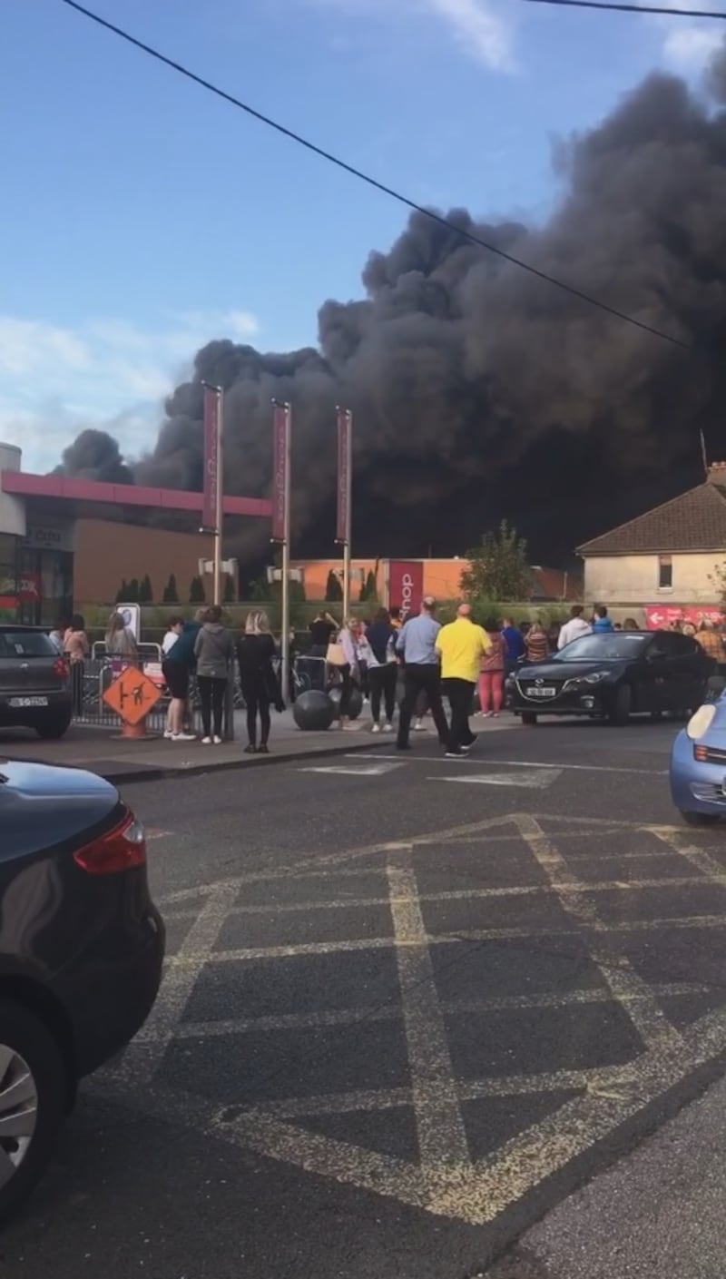 Plumes of smoke coming from the Village Shopping Centre in Douglas, Co Cork. Photograph: Olivia Kelleher