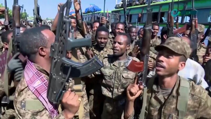 Ethiopian military cheering and dancing in front of cameras on a road in an area near the border of the Tigray and Amhara regions of Ethiopia. Image from an undated  video released by the state-owned Ethiopian News Agency on Monday. Photograph:  Ethiopian News Agency via AP