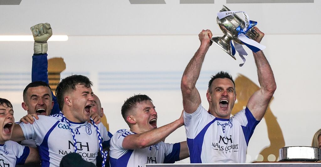 Naas captain Eoin Doyle lifts the cup after beating Celbridge in the Kildare Senior Football final at St Conleth's Park in Newbridge. Photograph: James Lawlor/Inpho