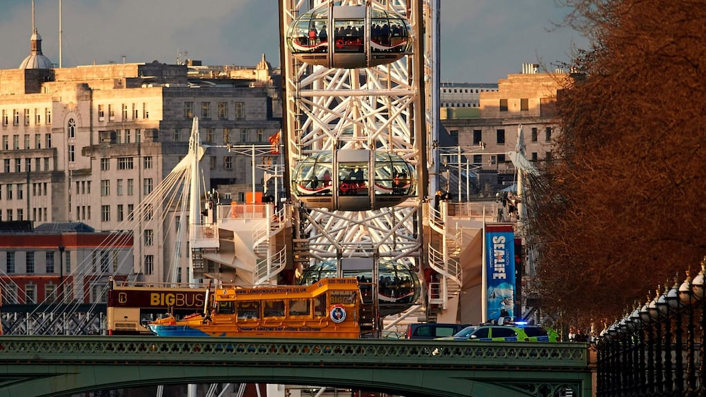 People inside London Eye pods, opposite the Houses of Parliament in Westminster on Wednesday. The emergency services tended to the dead and injured on Westminster Bridge. Photograph: Niklas Halle’n