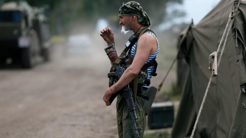 A Ukrainian soldier smokes at a temporary base near the city of Slaviansk today. Photograph: Reuters