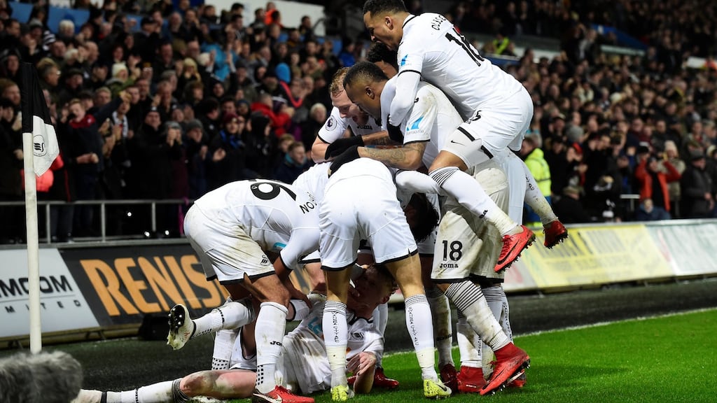 Swansea City’s Samuel Clucas celebrates scoring their third goal with team-mates in the Premier League game against Arsenal at the Liberty Stadium. Photograph: Rebecca Naden/Reuters