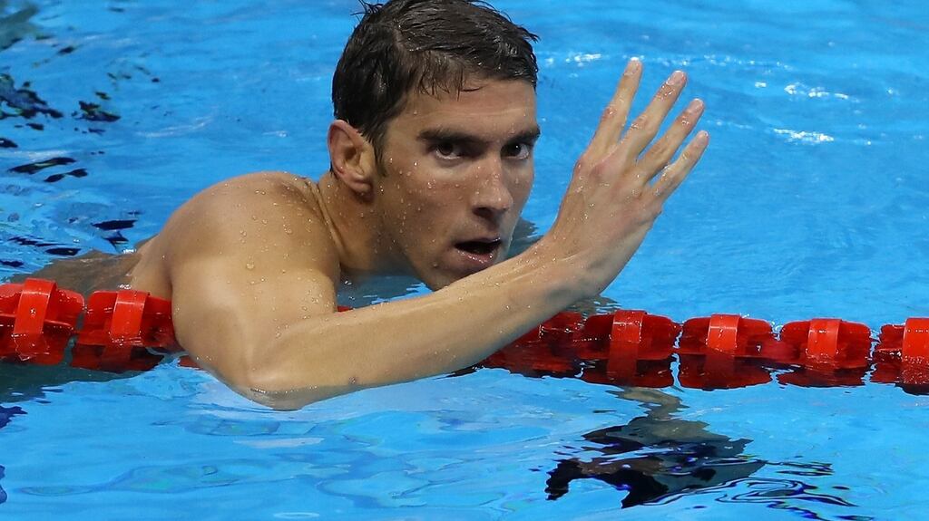 Michael Phelps of the United States celebrates winning the Men’s 200m Individual Medley Final. Photograph: Al Bello/Getty Images