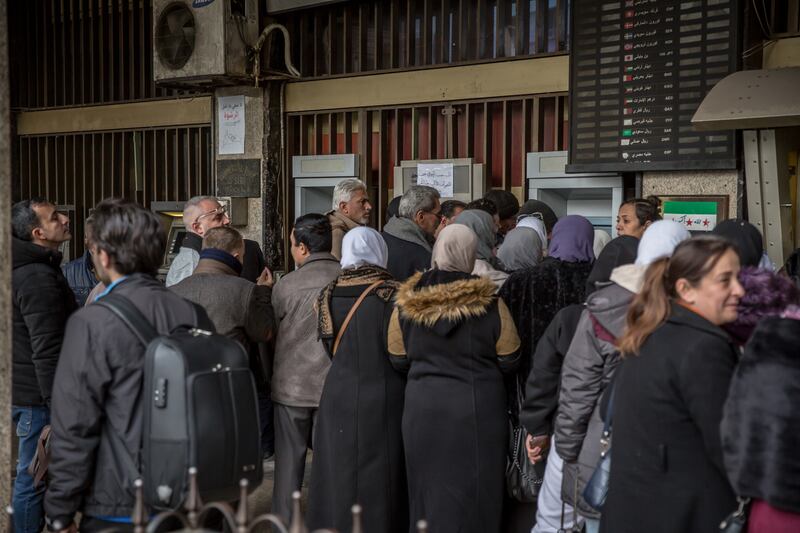 Queues for an ATM in Damascus. Photograph: Sally Hayden
