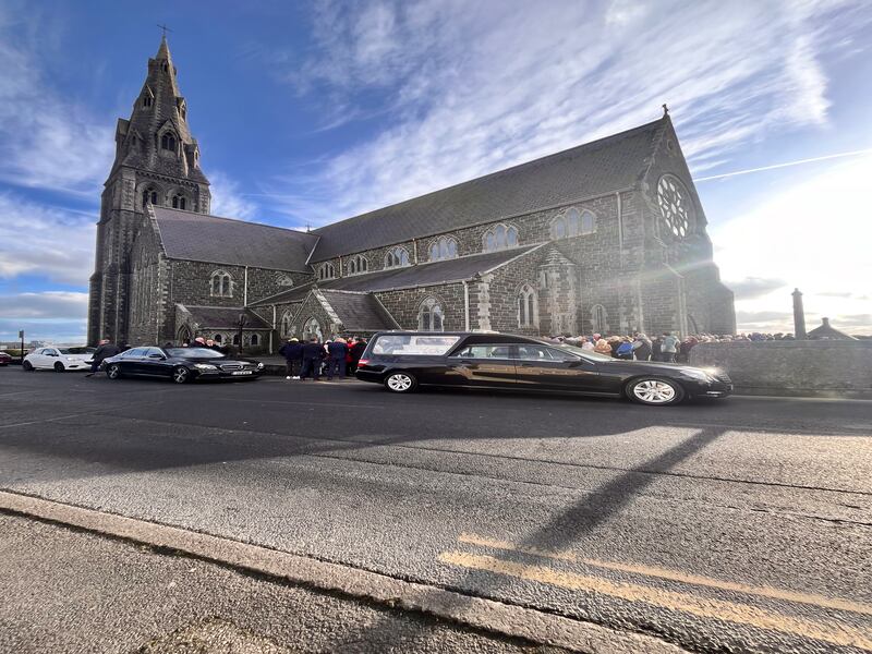 Mourners gather for the funeral of Kobi Macharia Dooly in Tramore