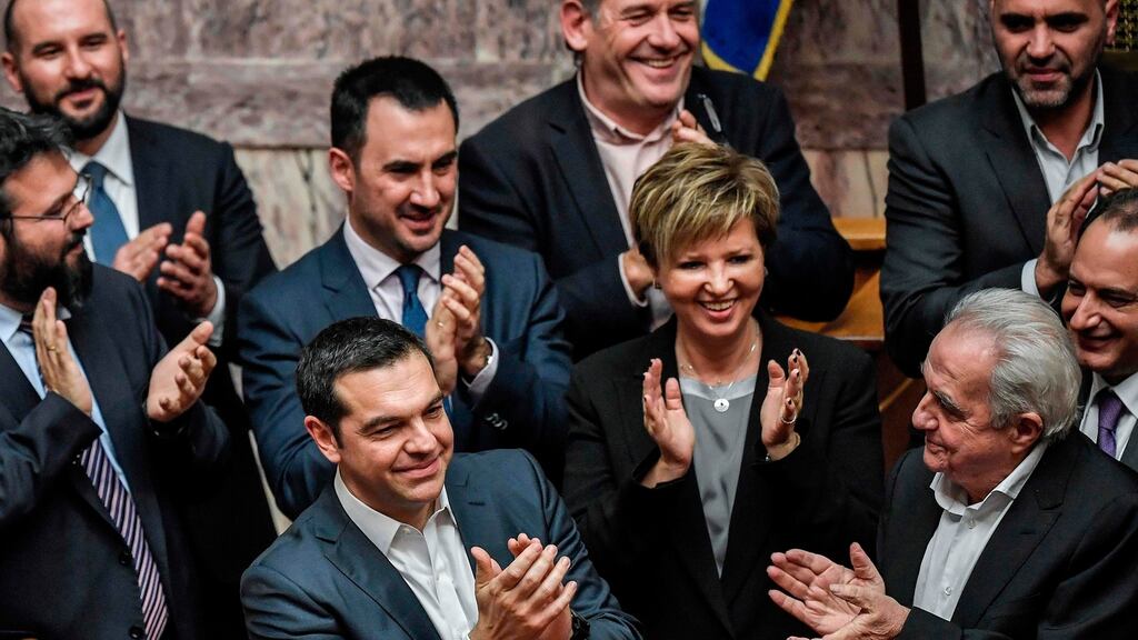 Greek prime minister Alexis Tsipras and members of his government applaud after winning a confidence vote in the parliament in Athens on Wednesday. Photograph: Louisa Gouliamaki/AFP/Getty Images