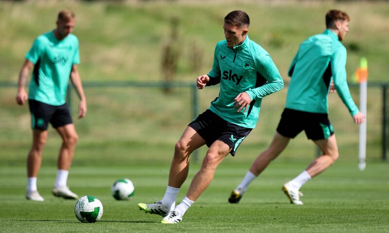 Dara O'Shea of Ipswich Town limbers up during Ireland squad training in Dublin. Photograph: Ryan Byrne/Inpho