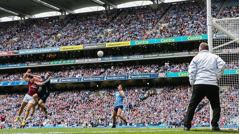 Galway’s Damien Comer scores a goal despite the challenge of Dublin goalkeeper Stephen Cluxton at Croke Park. Photograph: Tommy Dickson/Inpho