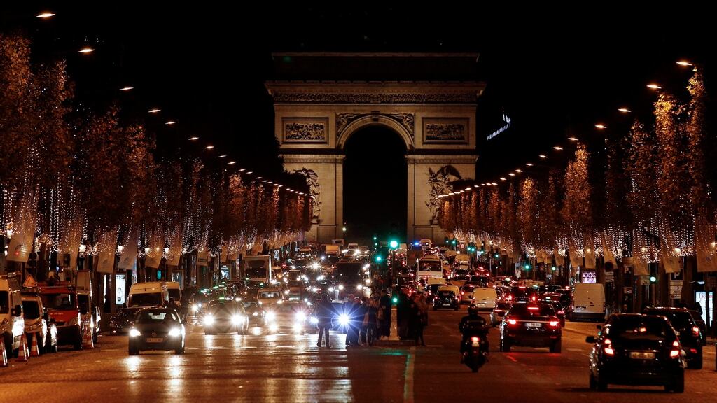 The Champs Élysées lit up with Christmas decorations on Monday. Photograph: Yoan Valat/EPA