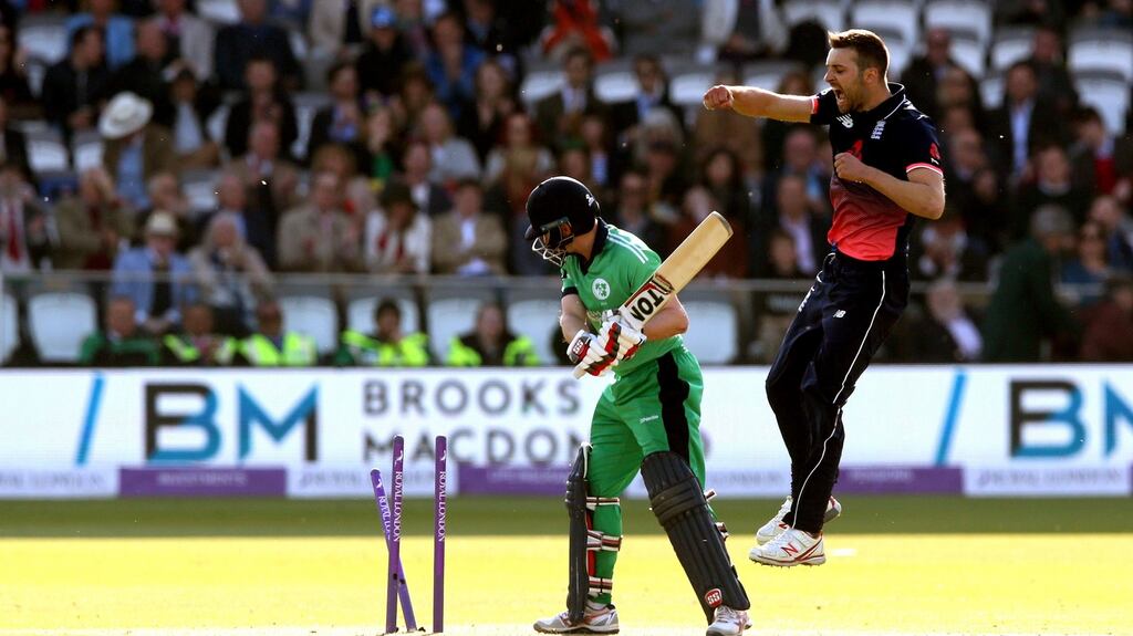 At Lord’s: Ireland’s William Porterfield is bowled out for 82 runs by England’s Mark Wood. Photograph: INPHO/Andrew Fosker