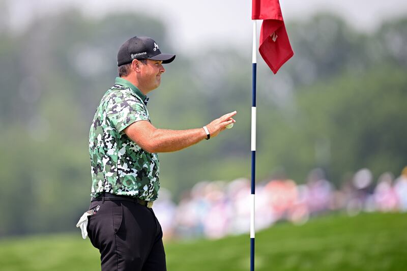 Patrick Reed after holing out for an albatross on the fourth hole. Photograph: Ross Kinnaird/Getty Images